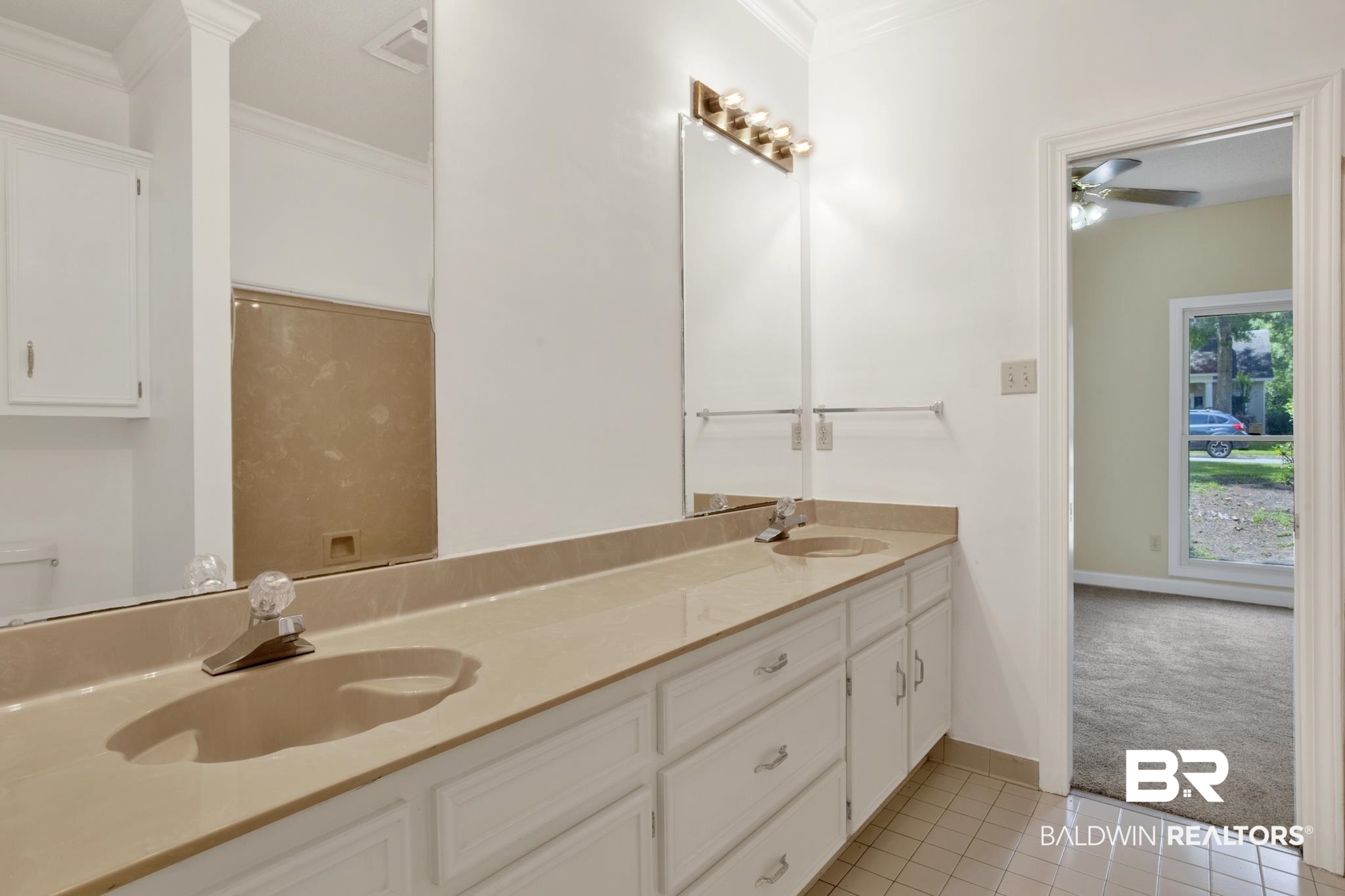 6805 Hunters Court Mobile, AL 36695 - Photo 24 of 37 Full bath featuring double vanity, tile patterned flooring, crown molding, ceiling fan, and baseboards