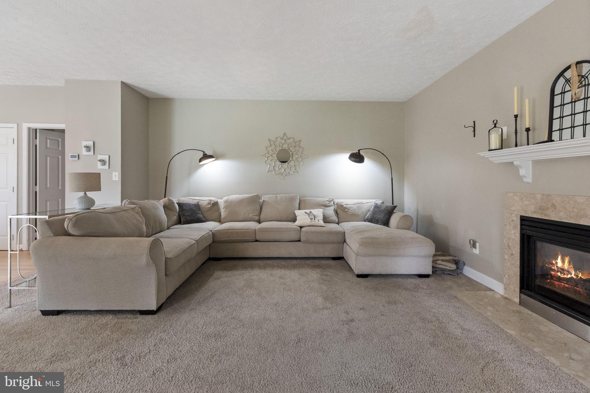 3207 Breckenridge Way Riva, MD 21140 - Photo 11 of 51 a living room with furniture and a fireplace