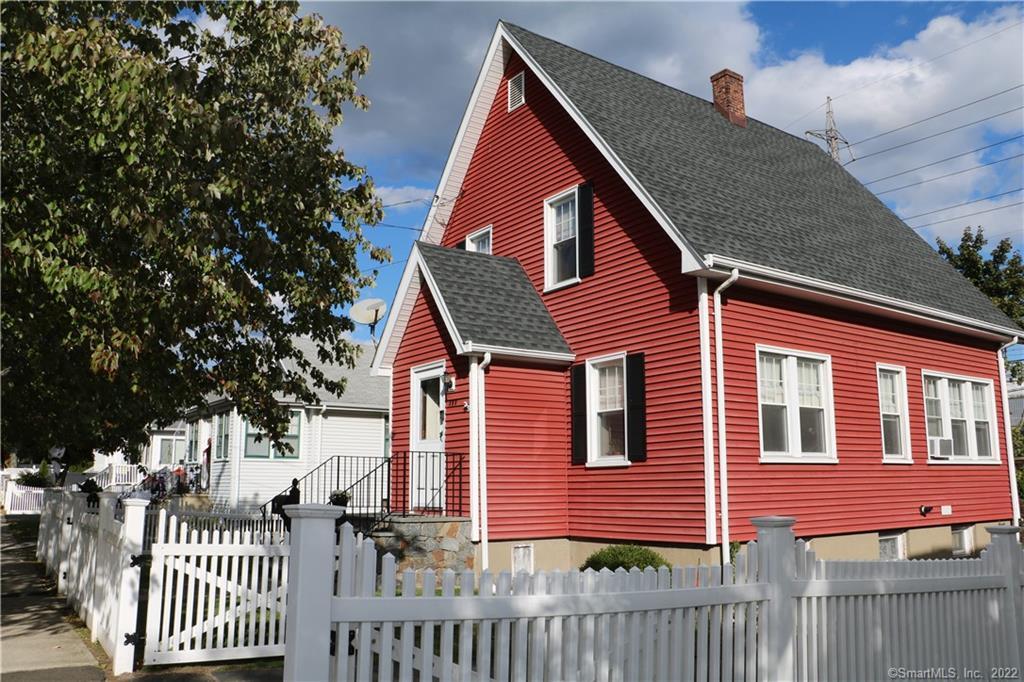 a front view of a house with a fence