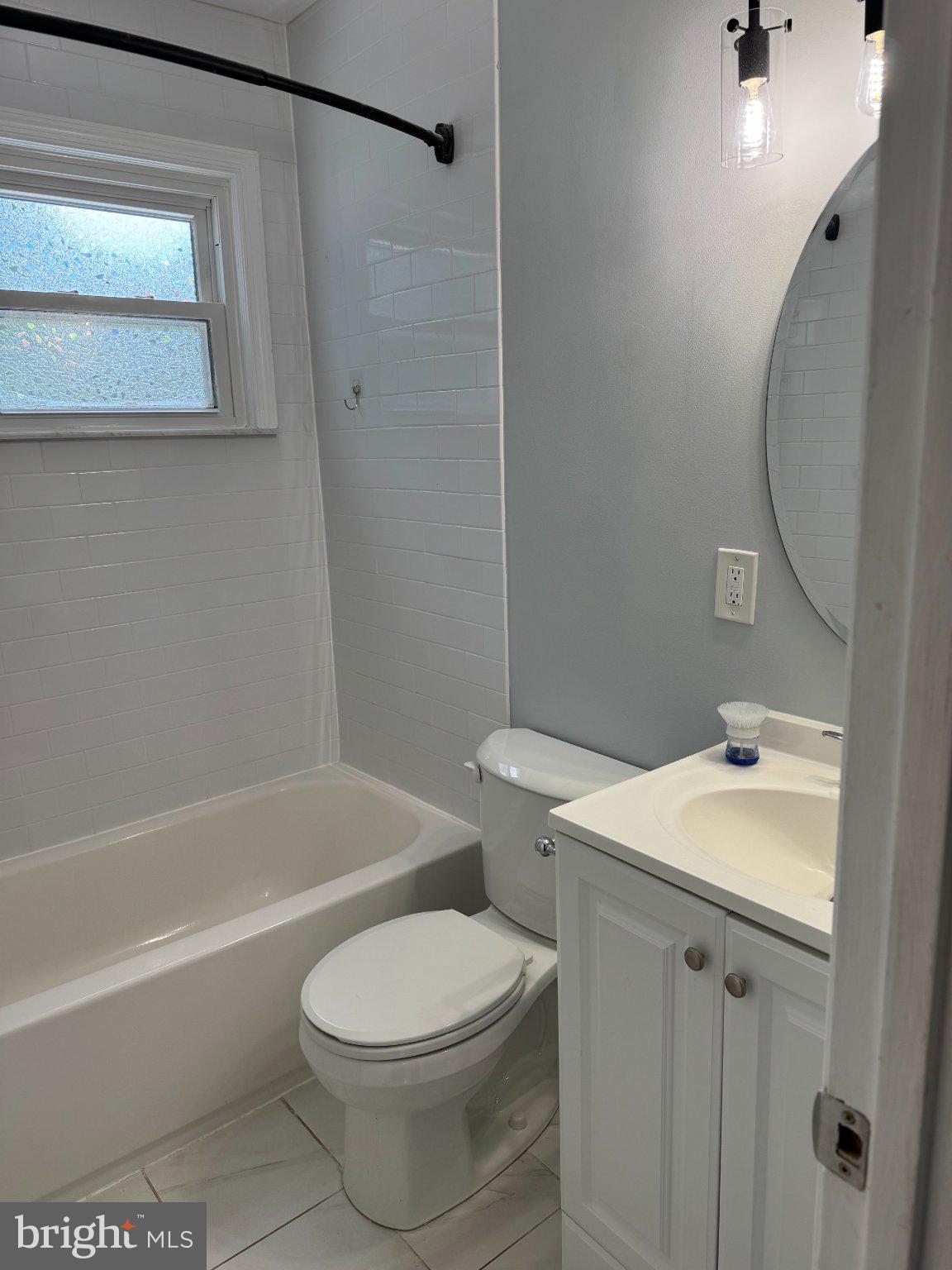 6603 Huntsman Boulevard Springfield, VA 22152 - Photo 34 of 64 Modern bathroom with sleek finishes.