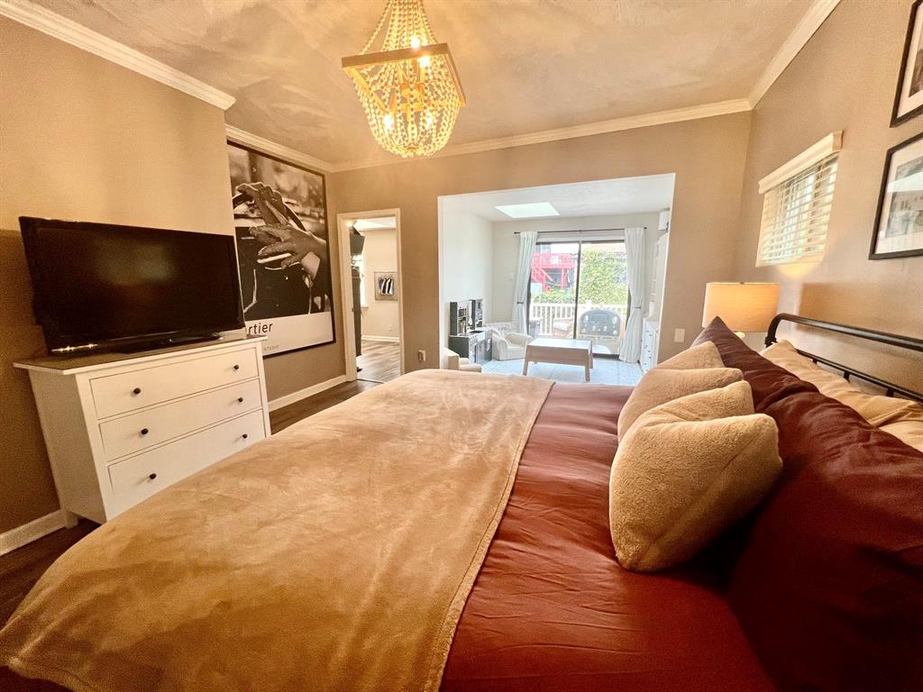 237 Lelia Street Pittsburgh, PA 15211 - Photo 22 of 46 a spacious bedroom with a bed and flat screen tv