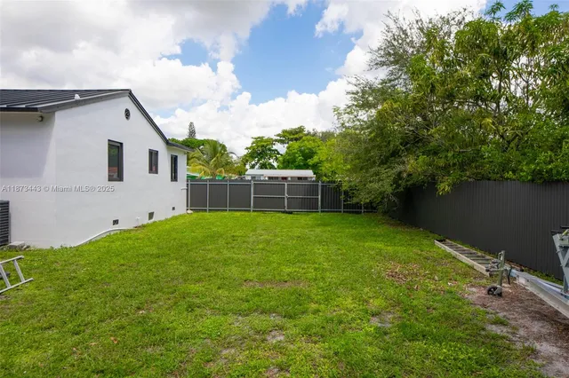 a view of backyard with garden and entertaining space