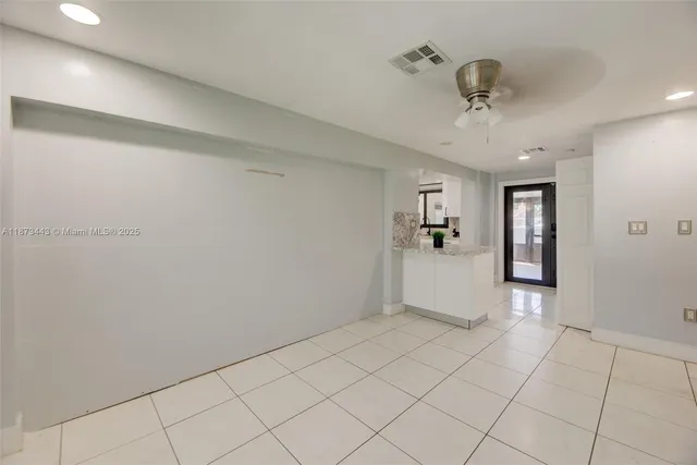 a view of a big room with windows and cabinet