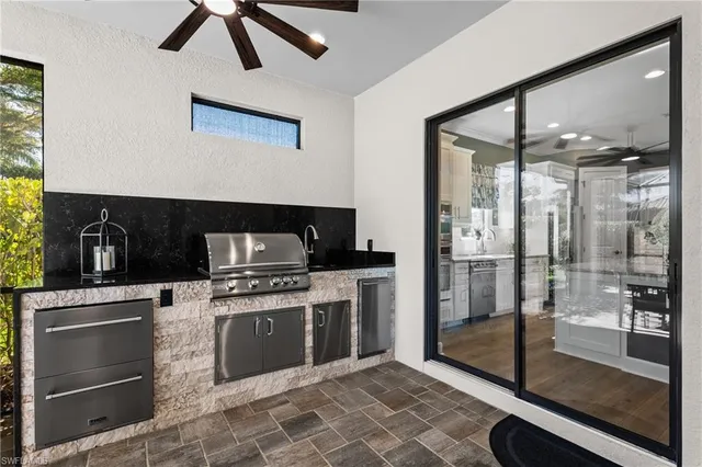 a kitchen with stainless steel appliances granite countertop a stove and a refrigerator