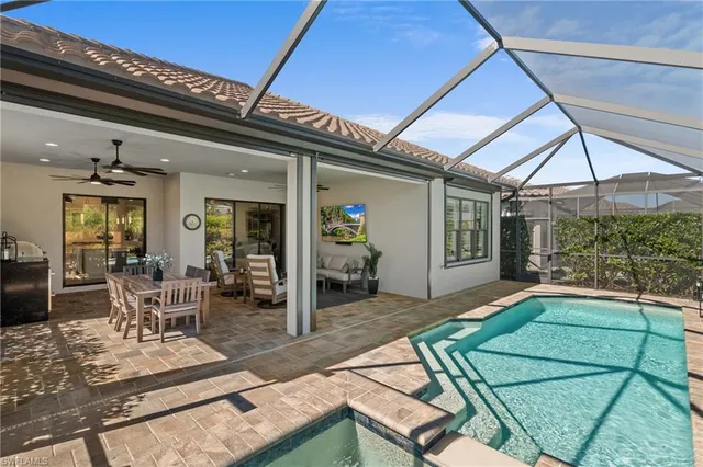 a view of a house with backyard porch and sitting area