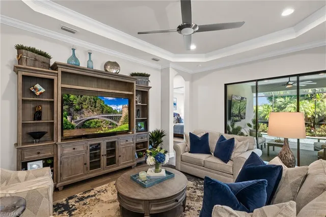 a living room with fireplace furniture and a flat screen tv