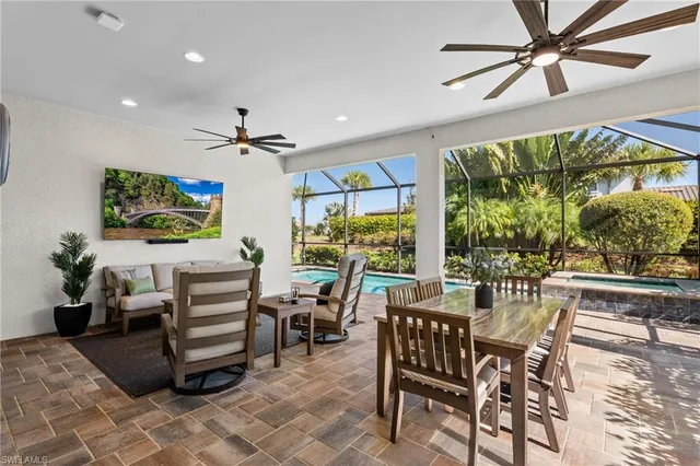 a view of a livingroom with furniture and a window