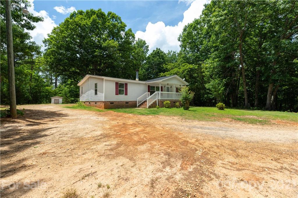1581 Goings Road Chester, SC 29706 - Photo 2 of 27 a white house that has a tree in front of it