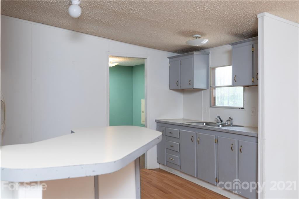 1581 Goings Road Chester, SC 29706 - Photo 6 of 27 a kitchen with a sink cabinets and wooden floor