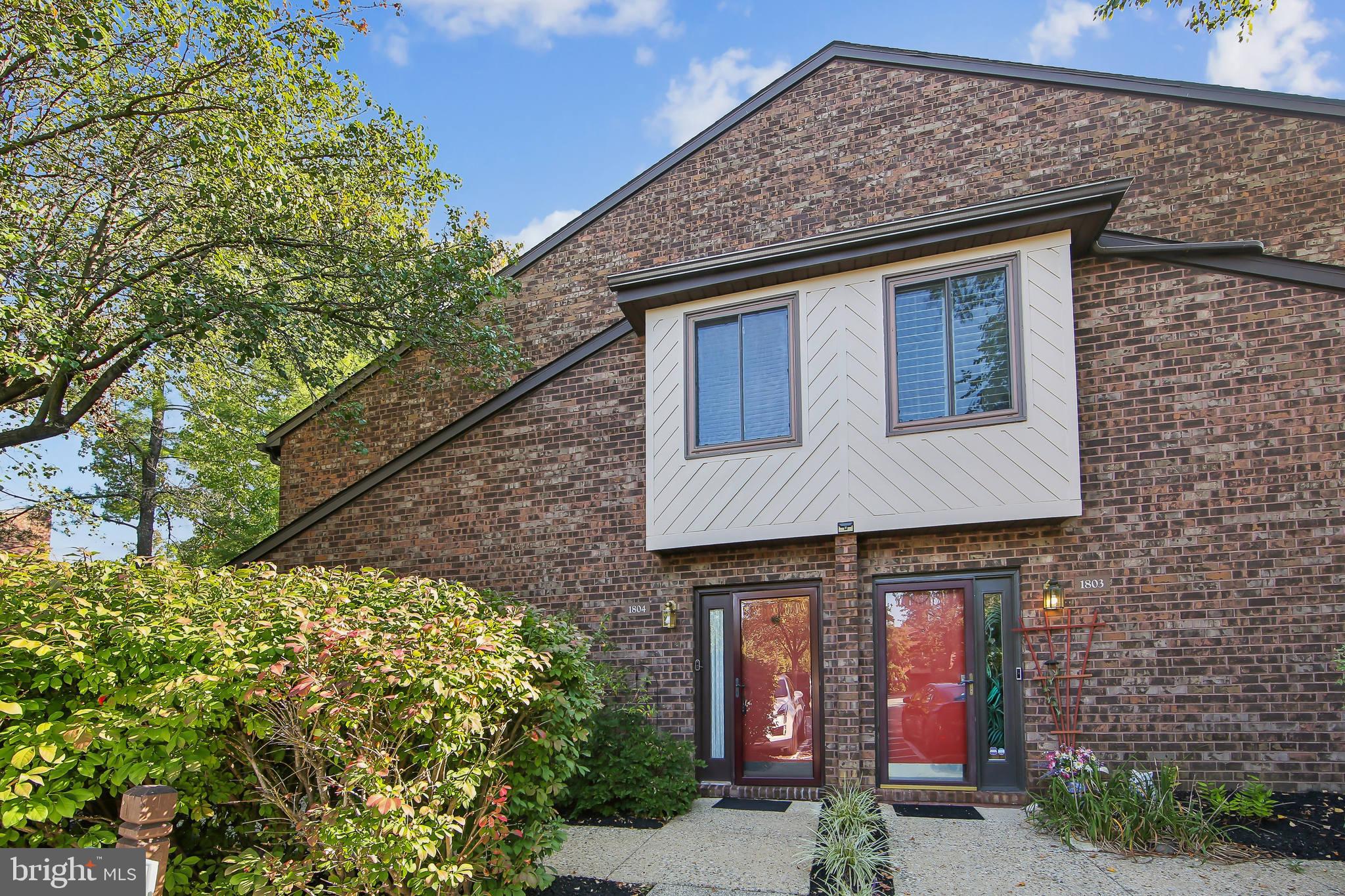 1804 Mountainview Drive, Unit 1804 Chesterbrook, PA 19087 - Photo 1 of 20 a front view of a house with garden