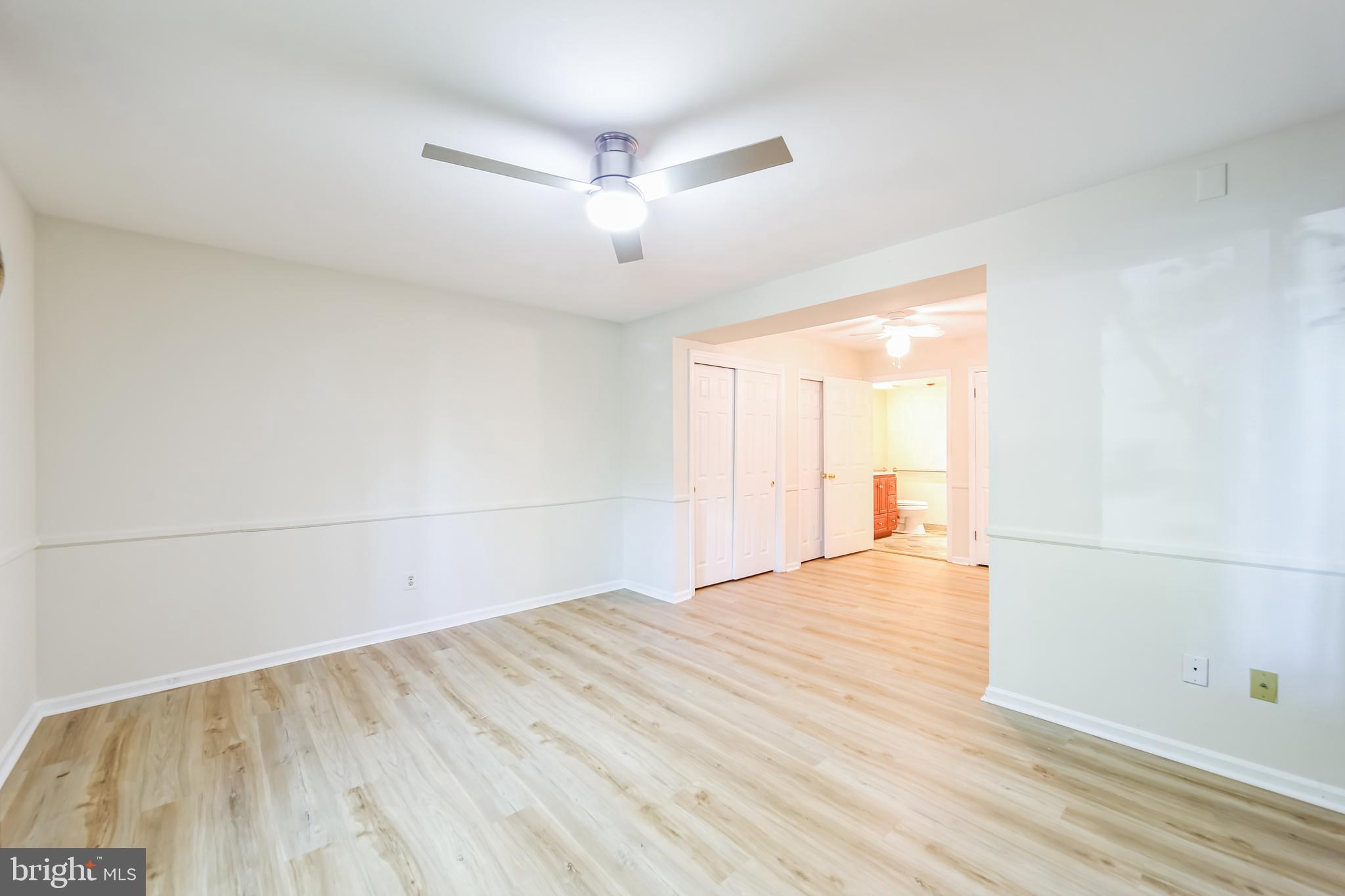 1804 Mountainview Drive, Unit 1804 Chesterbrook, PA 19087 - Photo 11 of 20 an empty room with wooden floor and windows