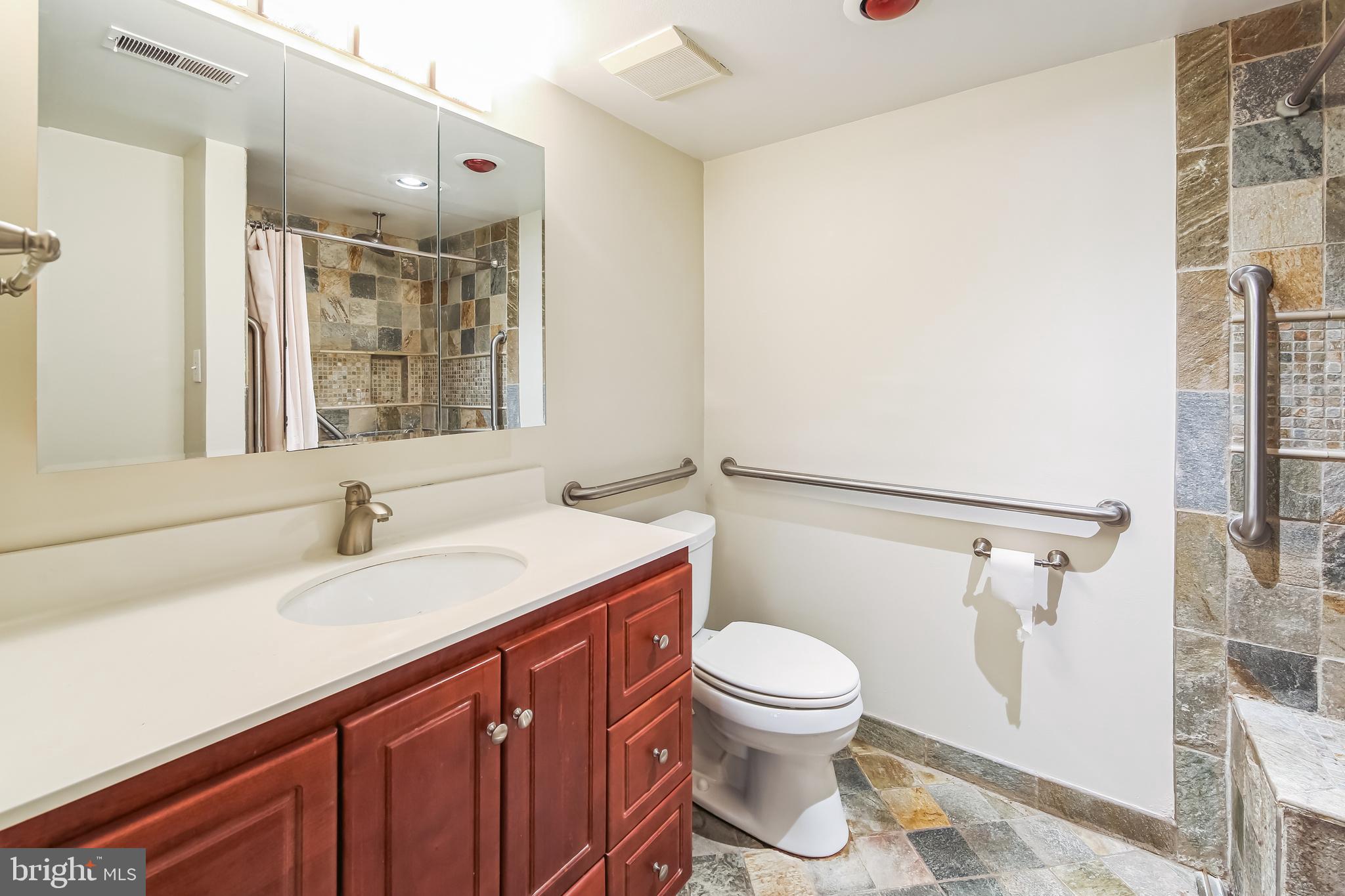 1804 Mountainview Drive, Unit 1804 Chesterbrook, PA 19087 - Photo 14 of 20 a bathroom with a sink a toilet and shower