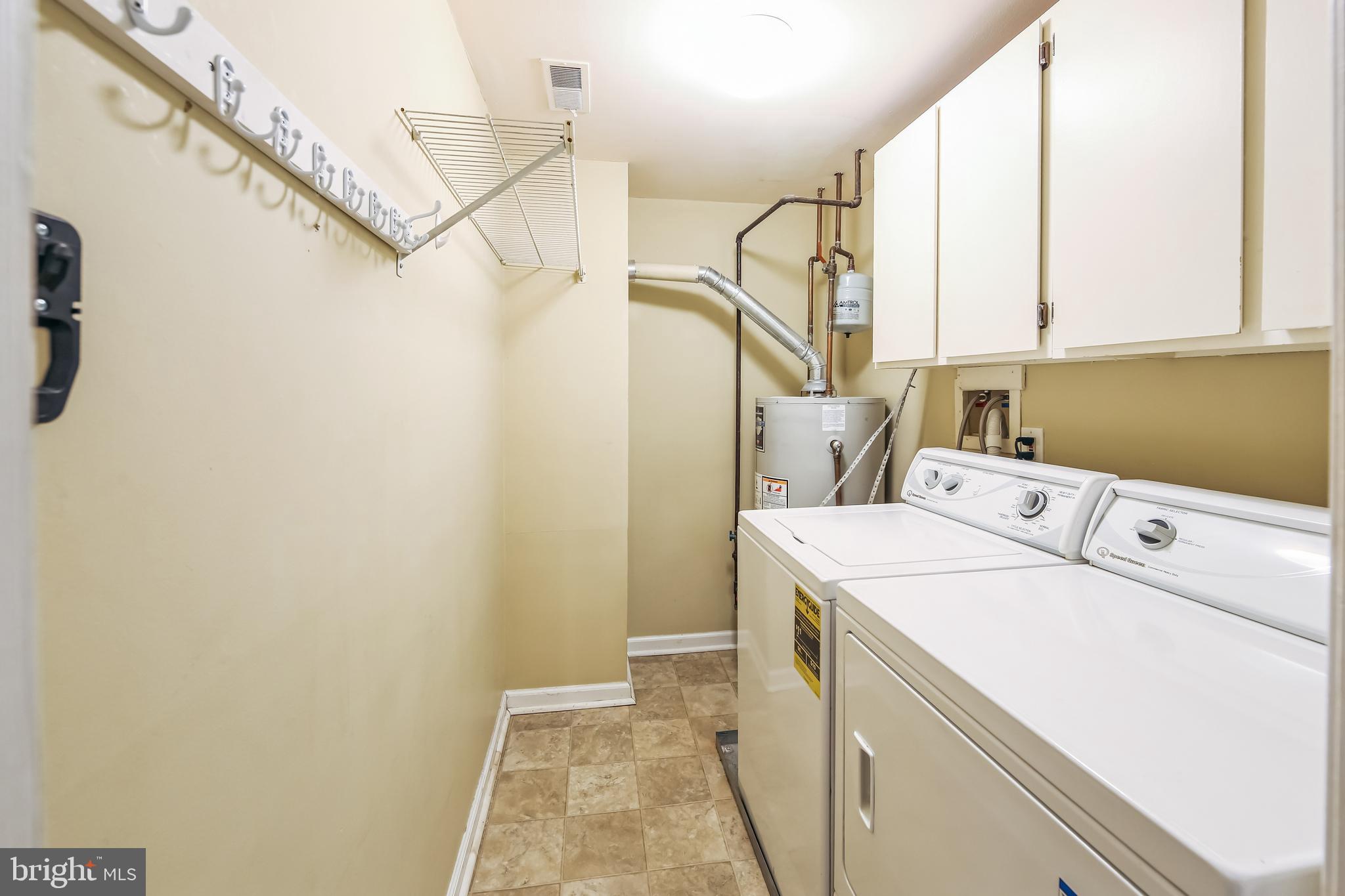 1804 Mountainview Drive, Unit 1804 Chesterbrook, PA 19087 - Photo 18 of 20 a utility room with dryer and washer
