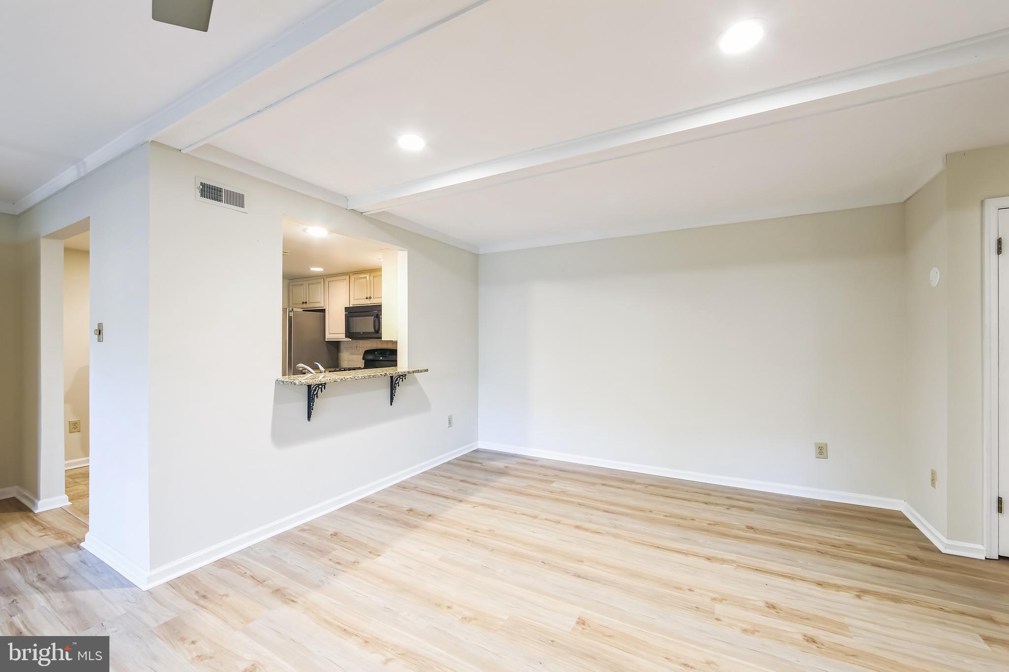 1804 Mountainview Drive, Unit 1804 Chesterbrook, PA 19087 - Photo 5 of 20 a view of a room with wooden floor and a flat screen tv