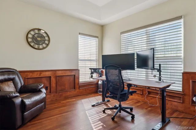 a view of a livingroom with workspace and a couch