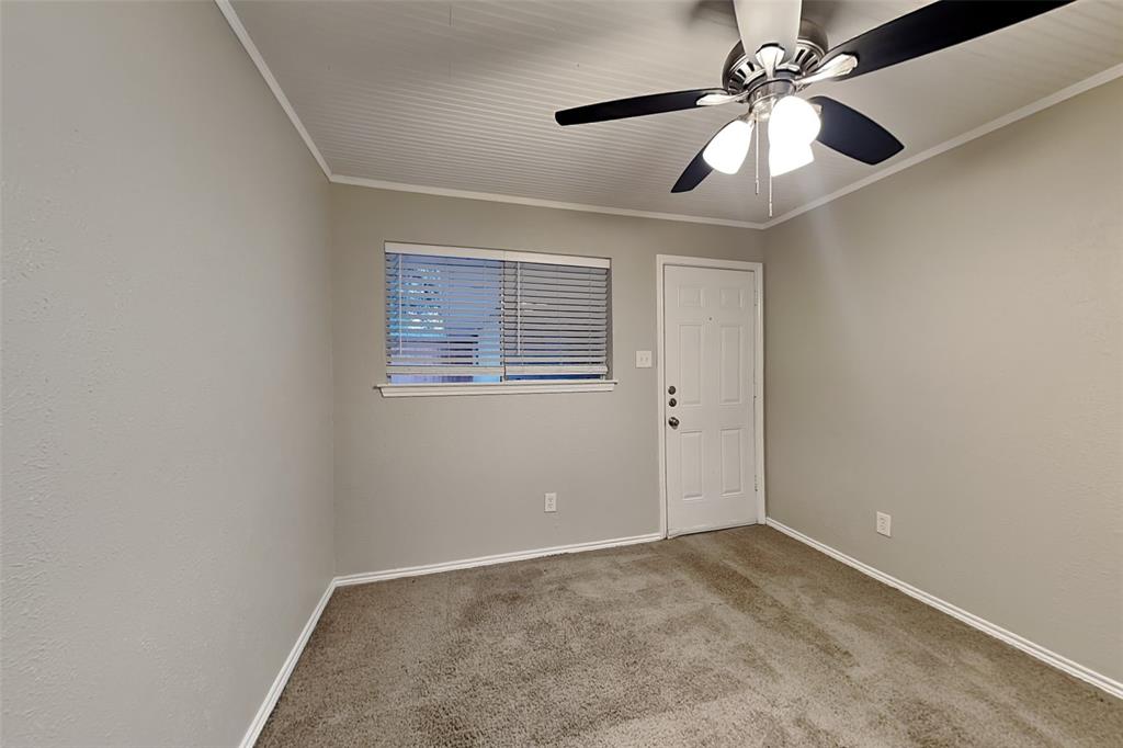 2705 South Colfax Circle Plano, TX 75075 - Photo 12 of 19 an empty room with a window and a fan