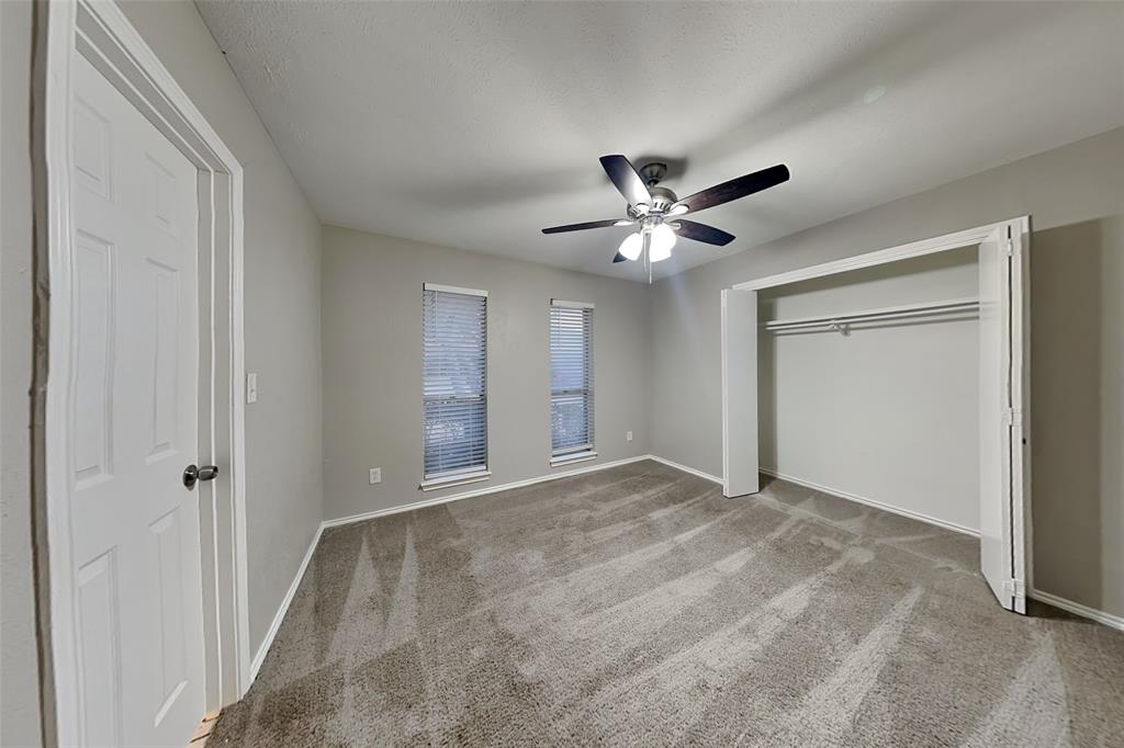 2705 South Colfax Circle Plano, TX 75075 - Photo 14 of 19 a view of an empty room with a ceiling fan