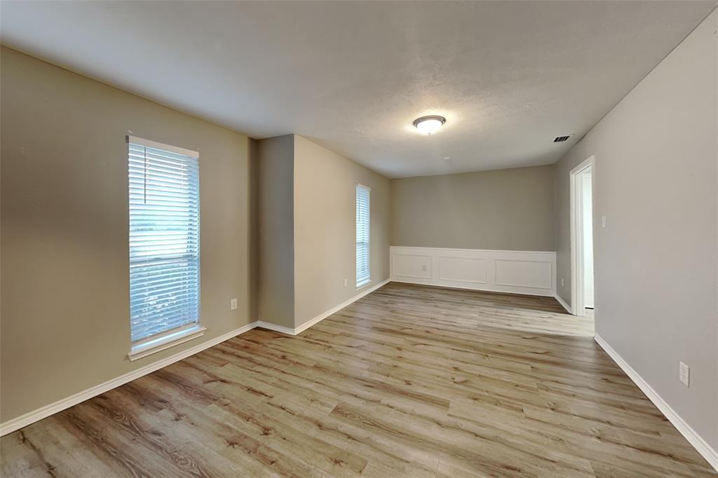 2705 South Colfax Circle Plano, TX 75075 - Photo 6 of 19 wooden floor in an empty room with a window