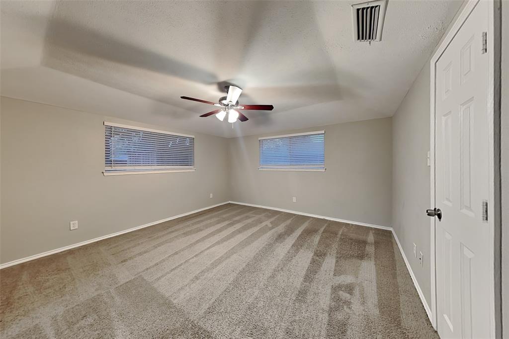 2705 South Colfax Circle Plano, TX 75075 - Photo 9 of 19 a view of an empty room with a chandelier fan