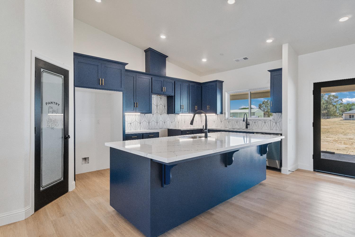 21035 Forest Glen Road Madera, CA 93638 - Photo 11 of 31 a kitchen with stainless steel appliances granite countertop a sink stove and refrigerator