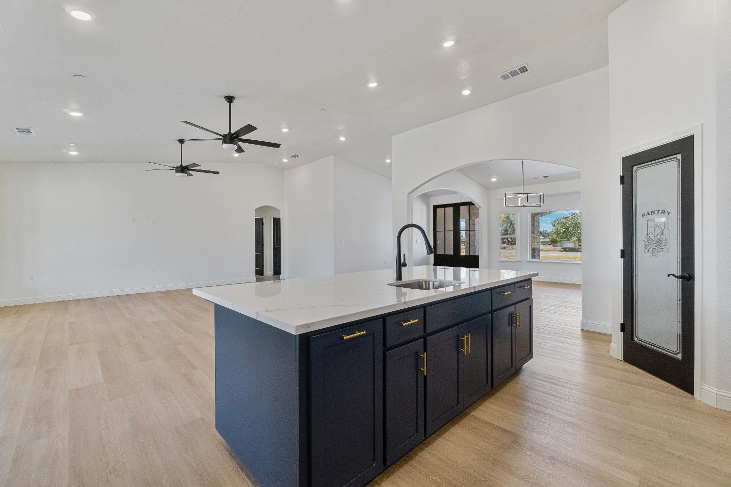 21035 Forest Glen Road Madera, CA 93638 - Photo 14 of 31 a kitchen with a sink a counter space appliances and cabinets