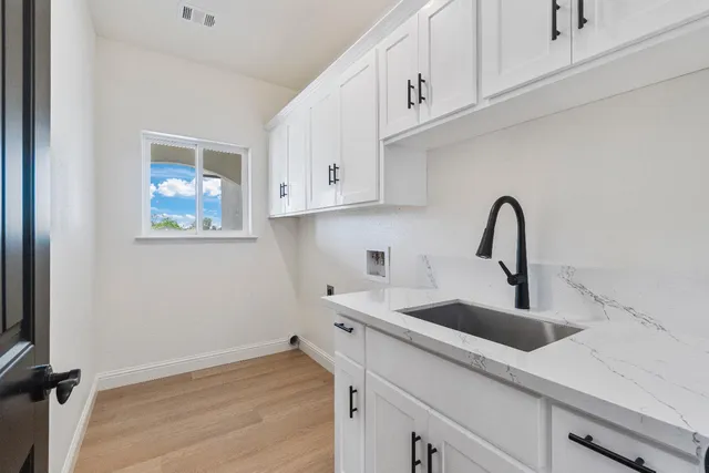 a view of a livingroom with a ceiling fan and window