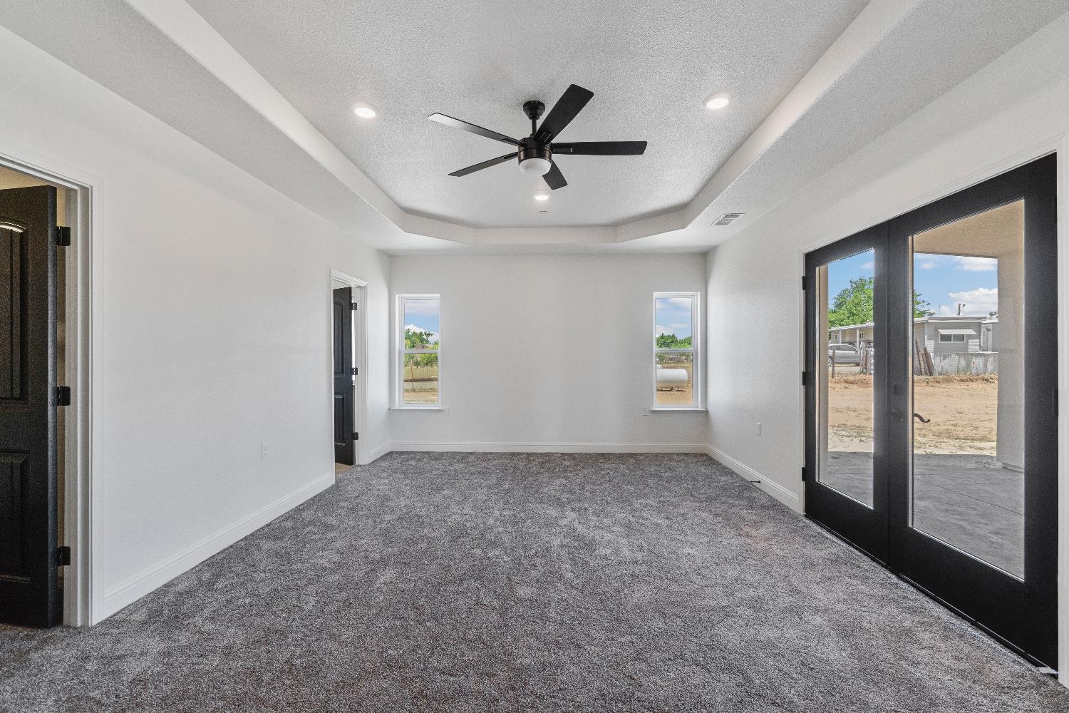 21035 Forest Glen Road Madera, CA 93638 - Photo 19 of 31 a view of a livingroom with a ceiling fan and window