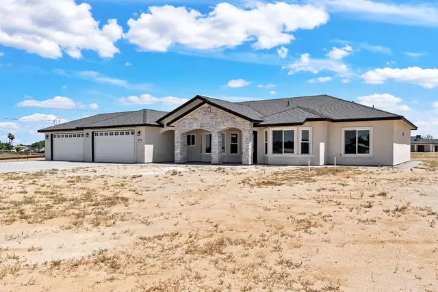 a front view of a house with a yard