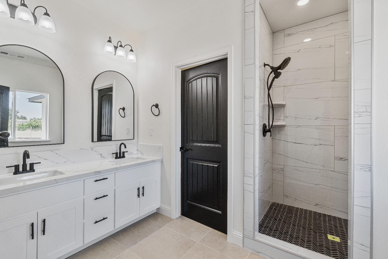 21035 Forest Glen Road Madera, CA 93638 - Photo 21 of 31 a bathroom with a double vanity sink and mirror