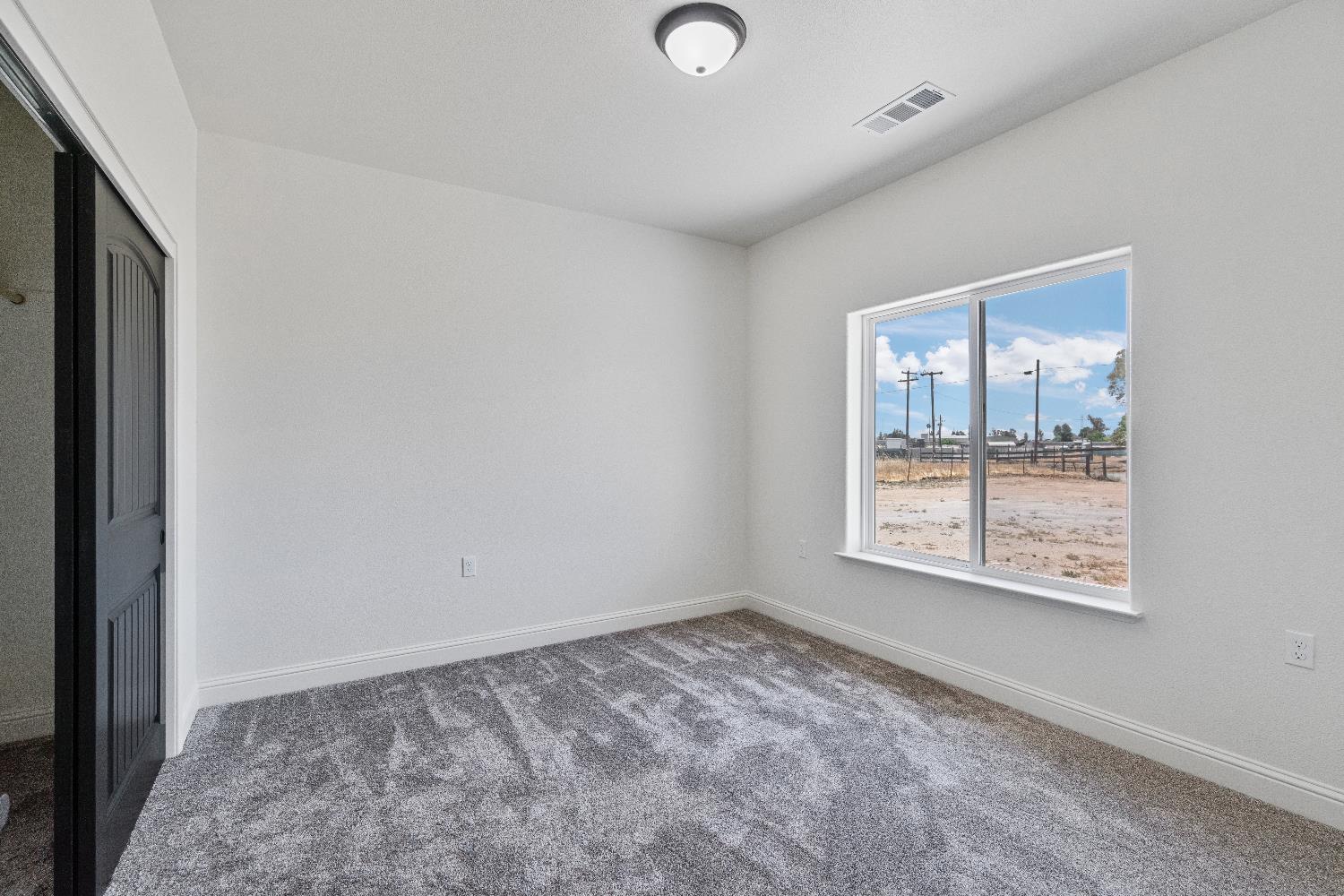 21035 Forest Glen Road Madera, CA 93638 - Photo 25 of 31 a view of empty room with window