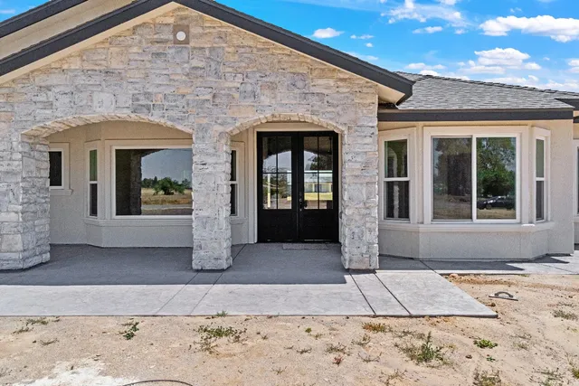a view of an entryway of a house with wooden floor