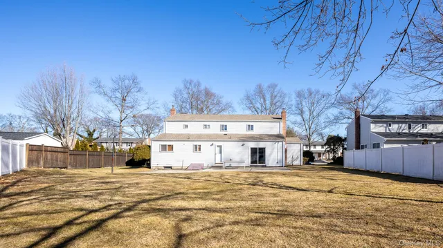 a view of a house with snow on the road