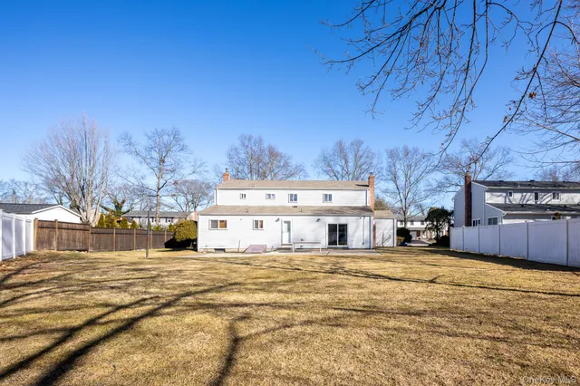 a large house with a large trees in front of it