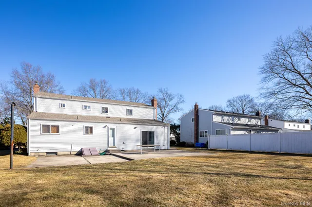 a view of a big house with a big yard