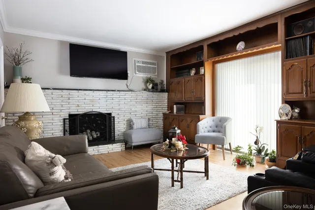 a living room with furniture flat screen tv and a fireplace