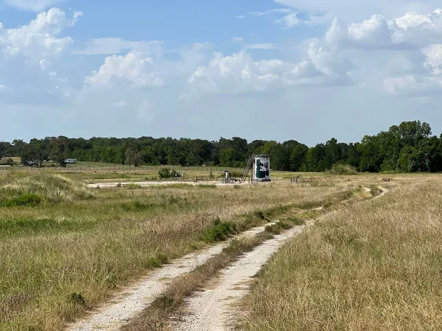 a view of a lake with houses in the back