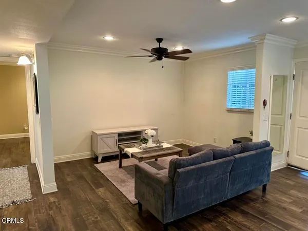 a living room with furniture and a table