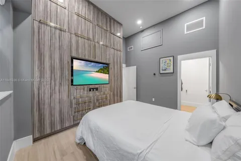 a view of walk in closet with clothes