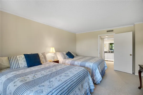 a bathroom with a granite countertop sink toilet a mirror and shower
