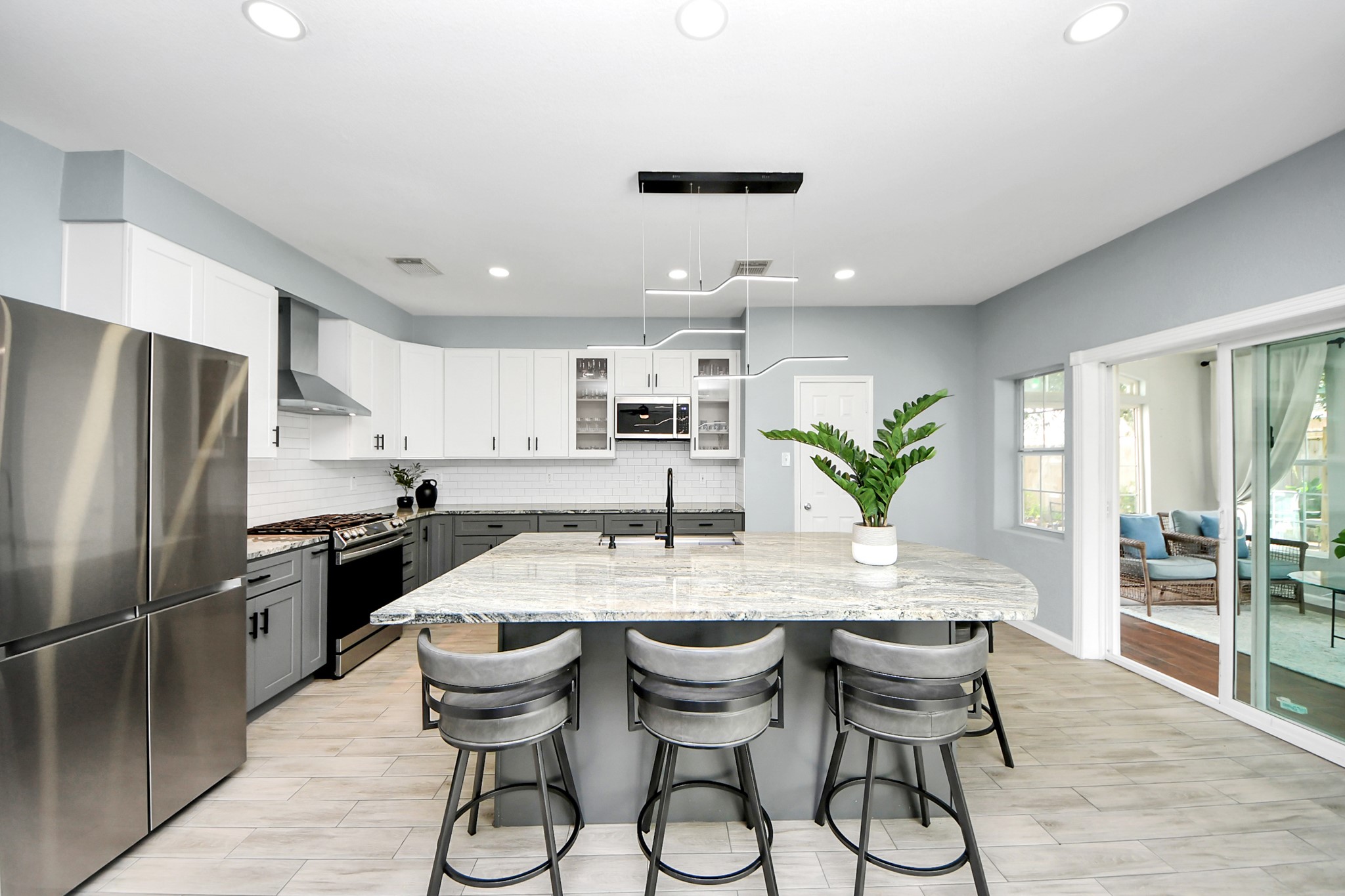 7619 Park Sage Lane Cypress, TX 77433 - Photo 1 of 48 a kitchen with granite countertop a counter space dining table and stainless steel appliances