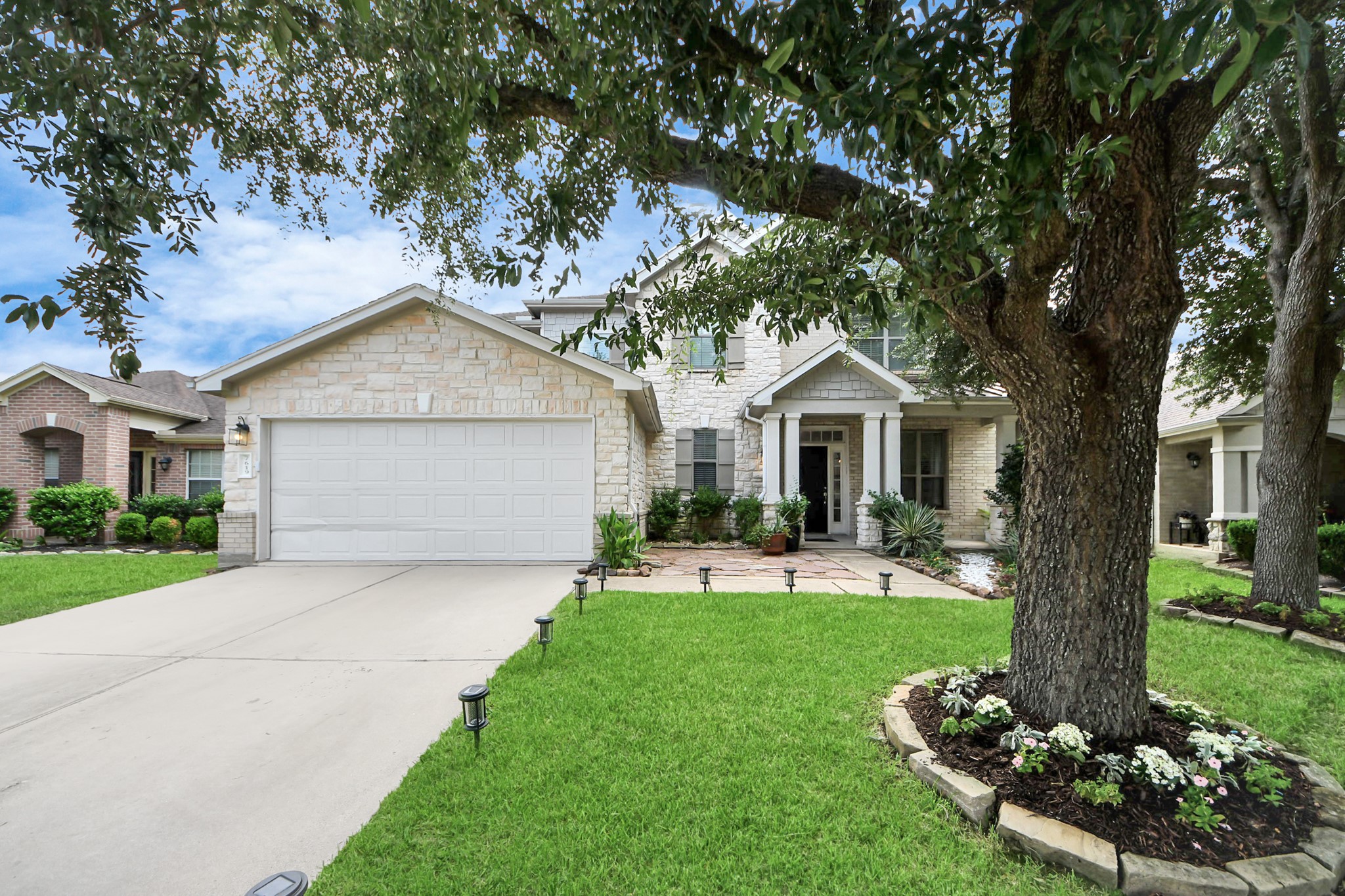 7619 Park Sage Lane Cypress, TX 77433 - Photo 2 of 48 a front view of a house with garden