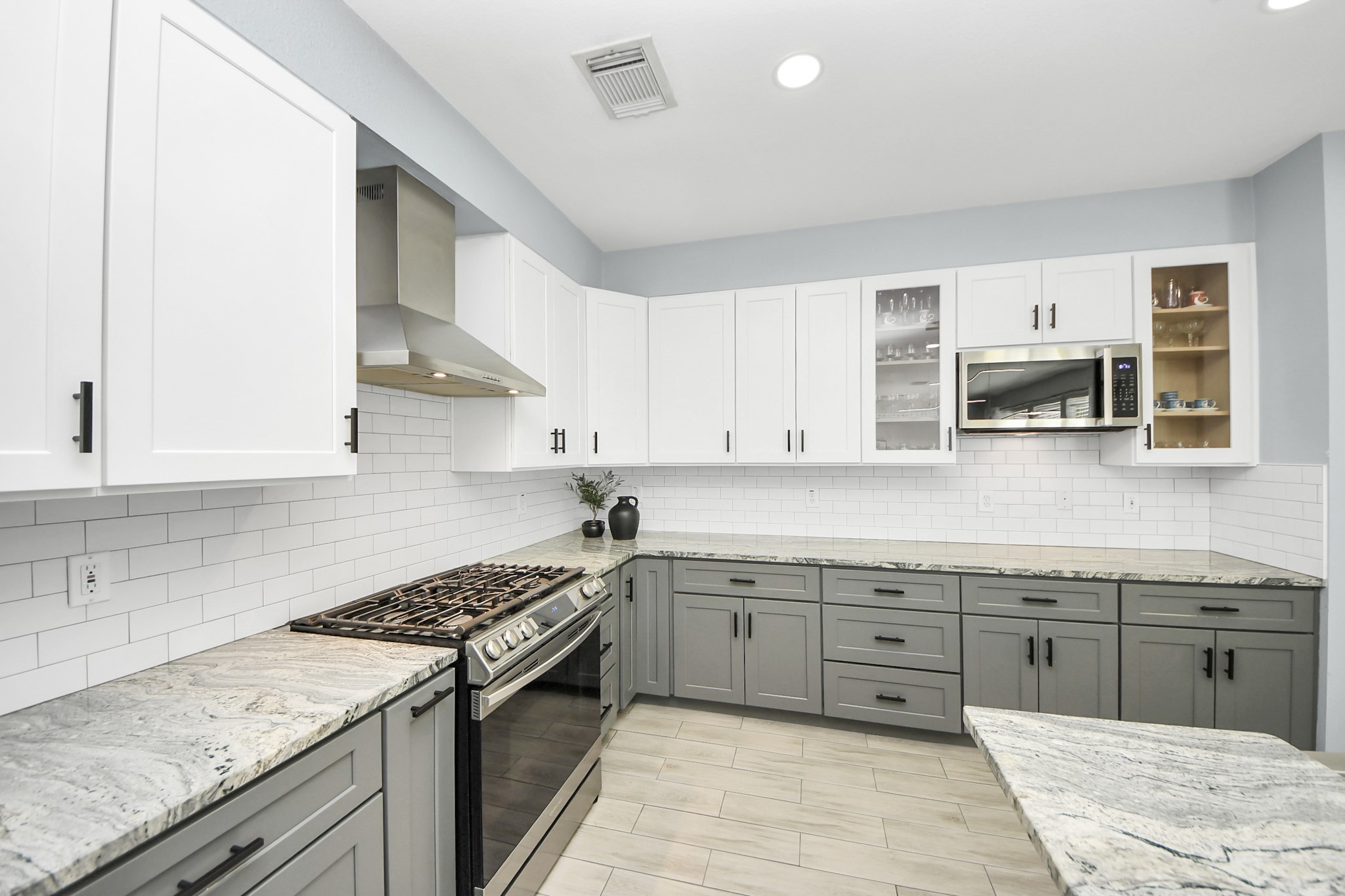 7619 Park Sage Lane Cypress, TX 77433 - Photo 26 of 48 a kitchen with a sink stove and cabinets