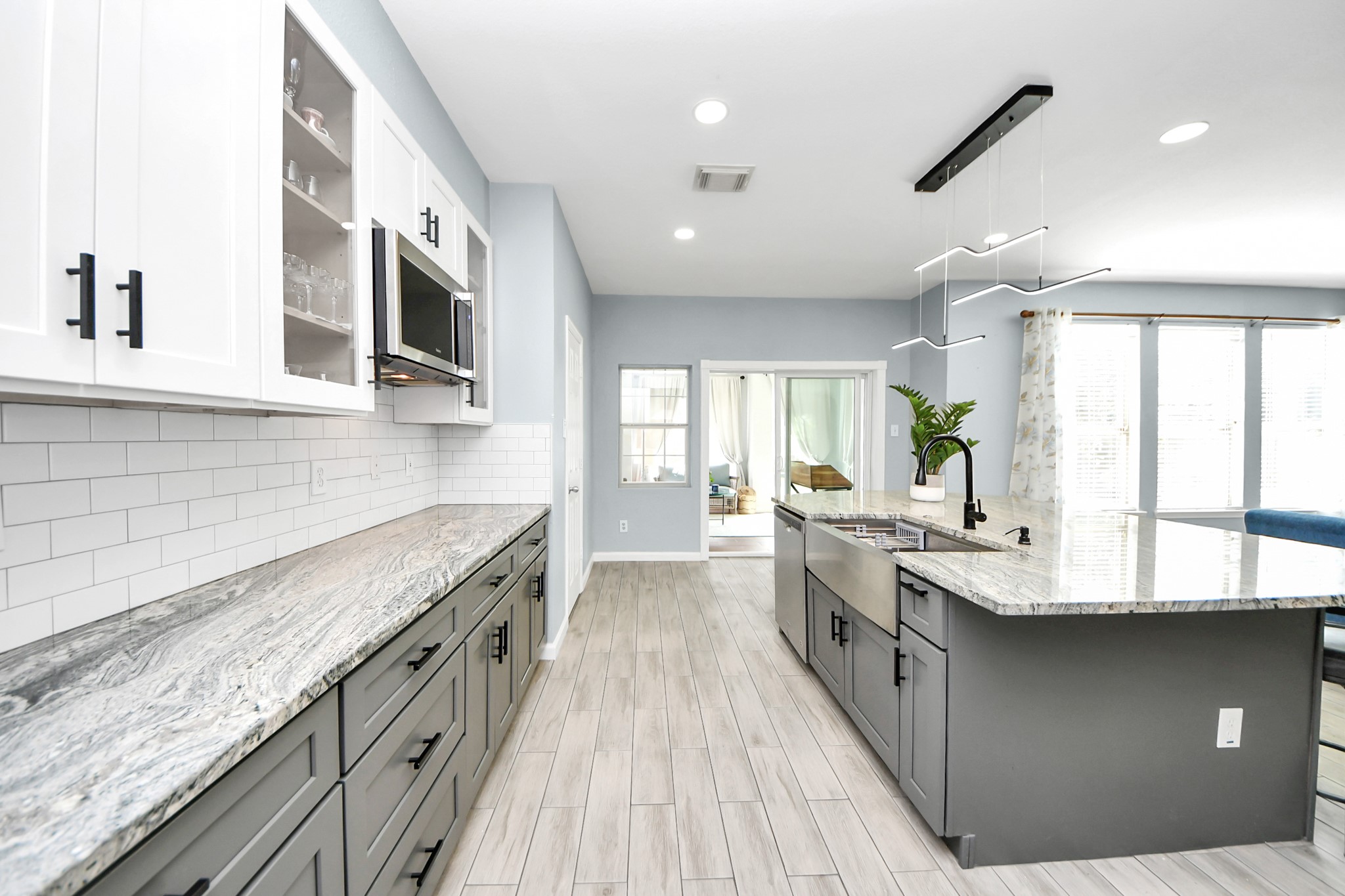 7619 Park Sage Lane Cypress, TX 77433 - Photo 27 of 48 a spacious kitchen with stainless steel appliances granite countertop a lot of counter space and a sink