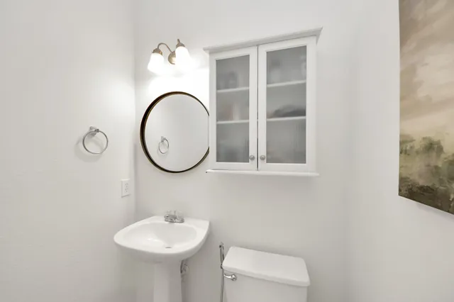 a bathroom with a sink and a mirror