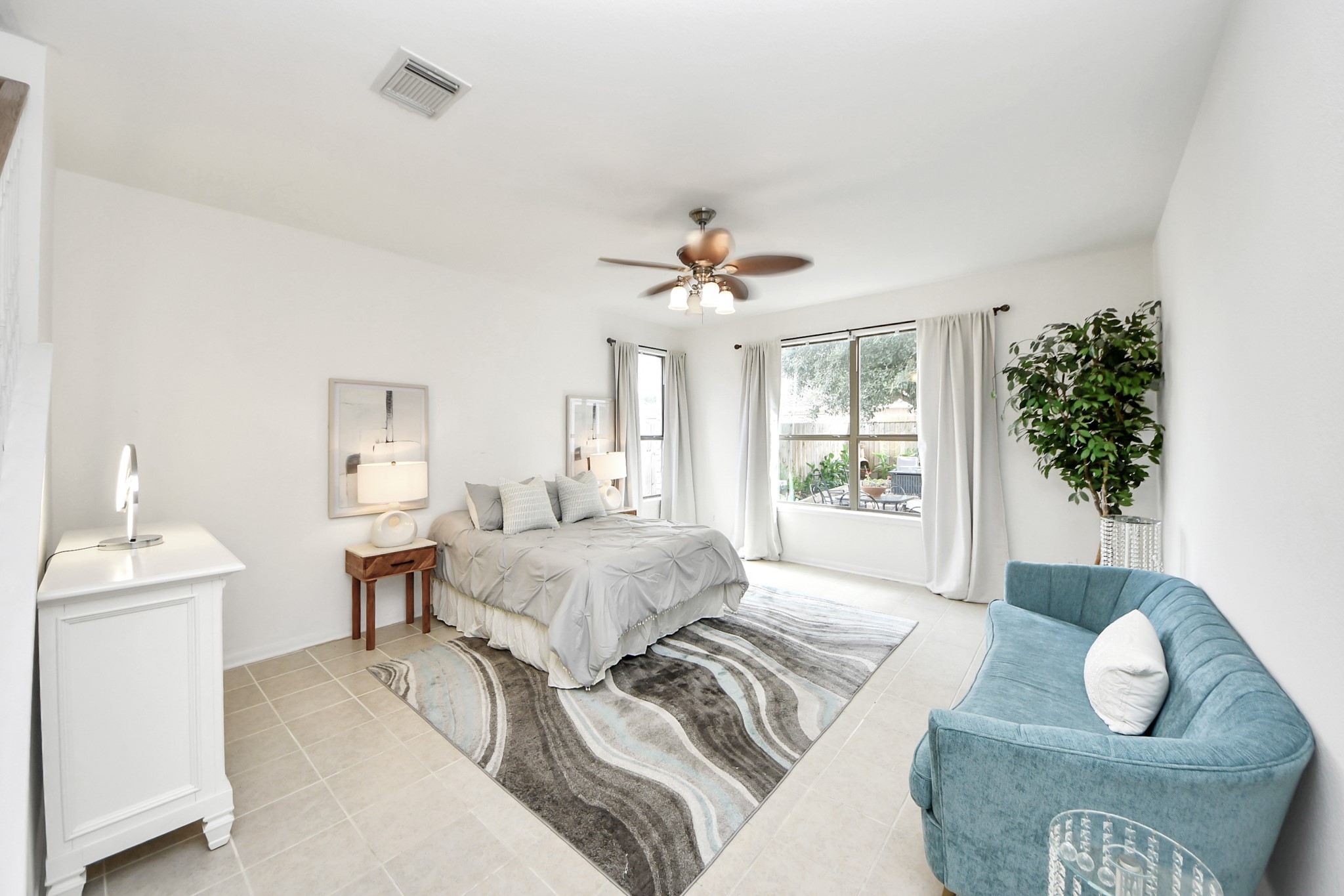 7619 Park Sage Lane Cypress, TX 77433 - Photo 30 of 48 a spacious bedroom with a bed and a chandelier