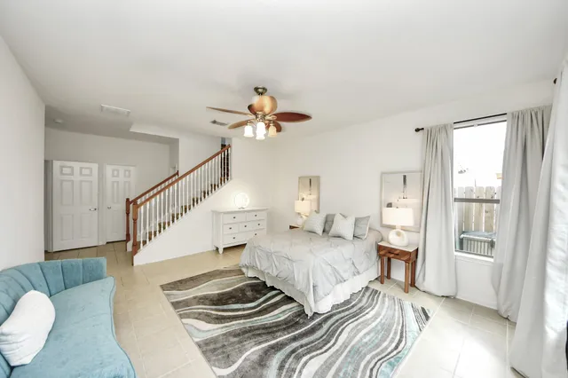 a bedroom with double bed and a window