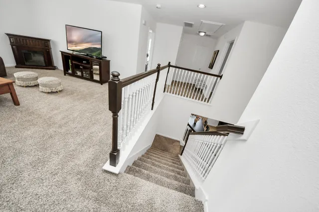 a view of entryway livingroom and hall with wooden floor