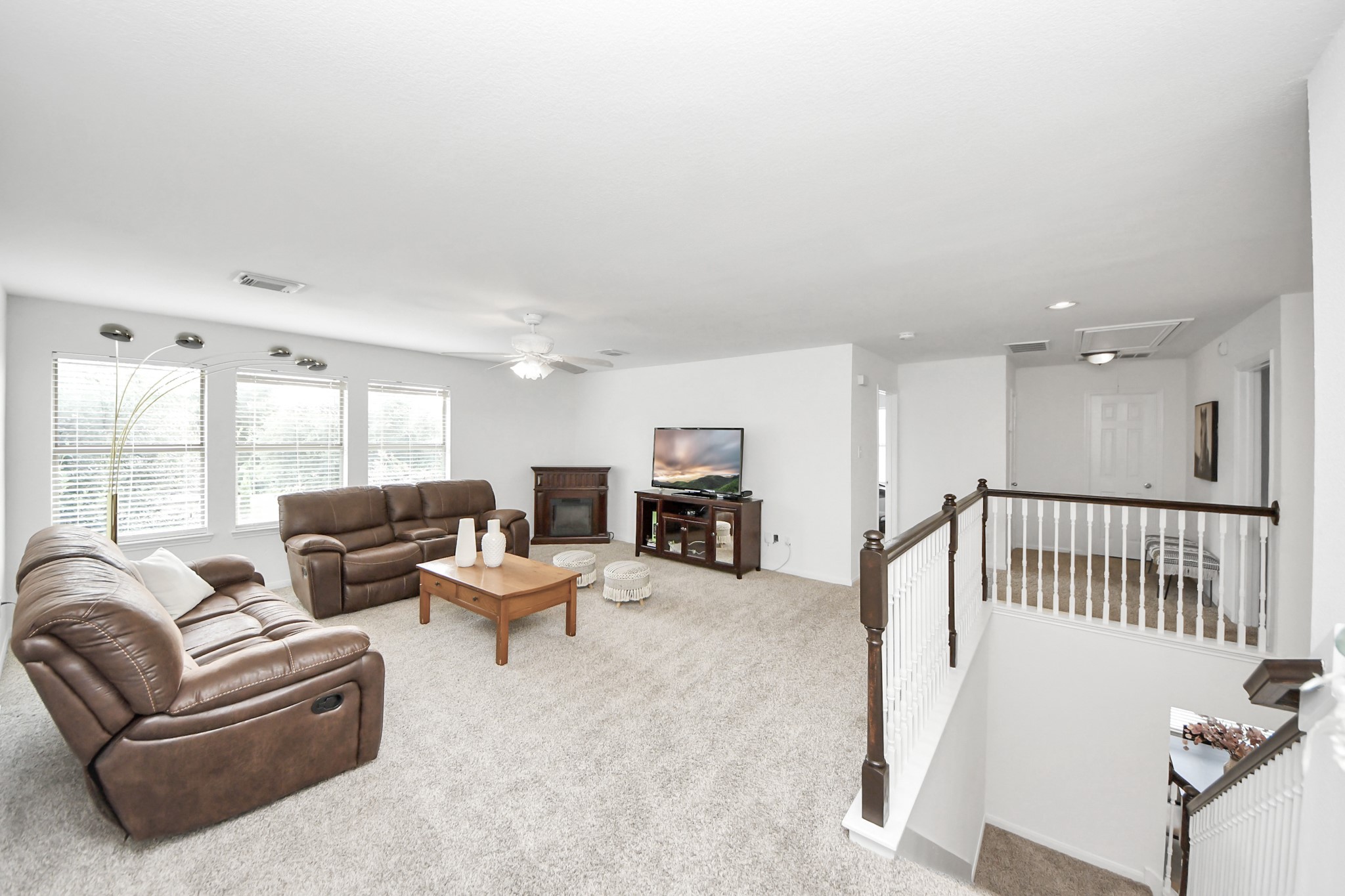 7619 Park Sage Lane Cypress, TX 77433 - Photo 38 of 48 a living room with furniture and a flat screen tv