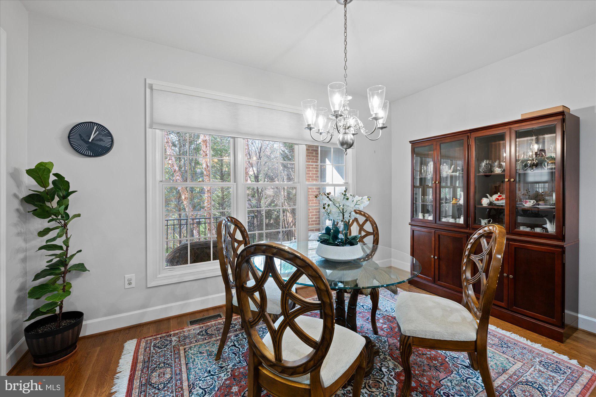 7822 Hidden Meadow Terrace Potomac, MD 20854 - Photo 13 of 29 a view of a dining room with furniture window and wooden floor