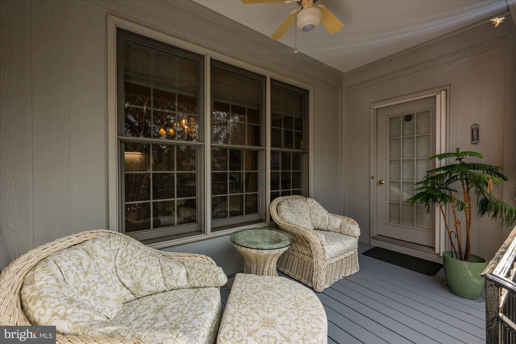 7822 Hidden Meadow Terrace Potomac, MD 20854 - Photo 14 of 29 a living room with furniture and a potted plant